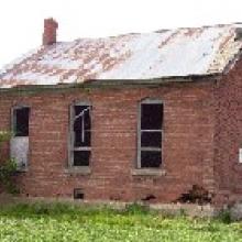 Dilapidated red brick school