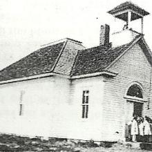 Black and white photo of a schoolhouse