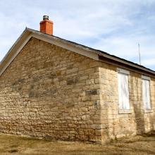Back of the stone schoolhouse