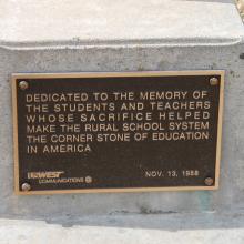 Dedication plaque outside the schoolhouse