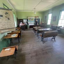 Photo showing the inside of the one room schoolhouse