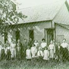 Lincoln No. 4 class photo in front of the schoolhouse